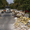 Are there any federal regulations that must be followed when removing and hauling debris?